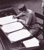 General Philippe LeClerc signing the surrender instrument on behalf of France aboard USS Missouri, Tokyo Bay, Japan, 2 Sep 1945