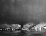 Strike photo of Manila Bay 5 Nov 1944 showing thick pall of smoke. Taken from aircraft from Bombing Squadron 80 flying from the USS Ticonderoga.