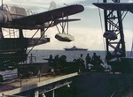 USS Yorktown (Essex-class) as seen from the fantail of Light Cruiser USS Mobile, during the October 1943 raid on Marcus Island. Note OS2U Kingfisher scout planes on Mobile’s two catapults.