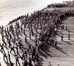 Line Crossing ceremony aboard USS Essex, 1 Sep 1944. Official captions reads, "The way of the Pollywog is hard."