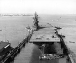 USS Intrepid entering the deperming station at Norfolk, Virginia, United States, 11 Sep 1943. Note the outline of the ship’s waterline painted on the flight deck. Photo 1 of 3.