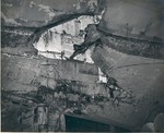 Looking up into a torpedo hole in the USS Intrepid hull 15 feet below the waterline near the starboard rudder, taken in Pearl Harbor Drydock #1, 26 Feb 1944. The damage was done 17 Feb 1944 off Truk.