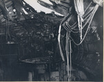 Damage to the flight deck and the hangar deck of USS Intrepid following the crash of a Japanese special attack aircraft off the Philippines, 25 Nov 1944