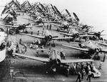 F6F-5 Hellcats being prepared for take-off aboard the carrier Franklin off Luzon, Philippine Islands, Oct 1944. Note SB2C Helldivers spotted aft.