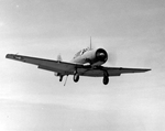 SNJ-4C Advanced Trainer on final landing approach aboard USS Bunker Hill, 21 Jun 1943 off Boston, Massachusetts, United States. Note extended flaps and tail hook.