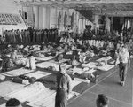 USS Wasp (Essex-class) hangar deck set up to accommodate 810 wounded transferred from the fleet for transportation to Hawaii after Wasp was ordered to the rear with typhoon damage to the flight deck, 31 Aug 1945