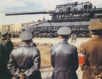 Adolf Hitler, second from right, Albert Speer, right, and others, at the Rügenwalde testing grounds in Pomerania (now Darłowo, Poland) on 19 Mar 1943 to see the giant 800mm railway gun “Dora,” sister gun to the “Gustav.”