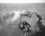 Following an attack from Japanese special attack aircraft, fires grew in the forward hangar deck of USS Saratoga off Iwo Jima, 21 Feb 1945. The fires increased greatly before they could be controlled. Photo 1 of 3