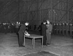 Commodore Leslie Gehres standing at attention while Vice Admiral Jack Fletcher presents him with the Legion of Merit award, Adak, Alaska, 19 Jan 1944. Photo 1 of 2.