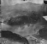 Strike photo taken from planes flying from USS Bunker Hill of Japanese Destroyer Escorts after being attacked in Unten Harbor, Okinawa, Japan, 10 Oct 1944