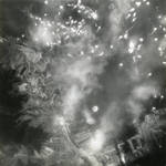Strike photo taken by US carrier planes during an air attack on Kure Naval Arsenal, Hiroshima, Japan, Jul 1945. Note anti-aircraft bursts and screening smoke in addition to bomb impacts.