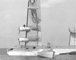 United States Coast Guardsmen assist in the recovery of a damaged PB2Y Coronado that partially capsized after losing a wing float on landing in Jamaica Bay, New York, United States, 29 Oct 1943