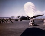 US Marine paratroopers training on handling parachutes in heavy winds, Navy Auxiliary Air Station at Camp Kearny, California (now Miramar), 1942. Note rare R3D aircraft, only 12 such planes were made.