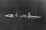 Post-war photo of the hulk of the battleship Hyûga, badly battered and sunk in shallow water near Kure, Japan on 24 Jul 1945. This photo was taken in Sep 1945.