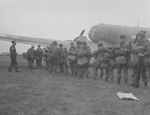 Members of the 82nd Airborne Division having their gear checked by the jumpmaster for the last time before entering their C-47 Dakotas for the Market Garden operation at Cottesmore airfield, England, 17 Sep 1944