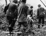 US Marine evacuating wounded comrade, Peleliu, Palau Islands, 1944