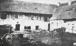Lidice, Czechoslovakia in the 1930s. Courtyard of the Horák family farm. The X marks the entrance to the cellars where the village men were gathered on the night of 9 Jun 1942.
