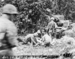 Treating a wounded US Marine, Bougainville, Solomon Islands, 1943-1944