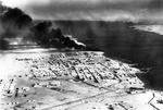 Smoke rising from the port of Tobruk, Libya, 22 Jan 1941.