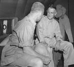 General Joseph Stilwell speaking with an unidentified major general in a passenger aircraft, New Delhi, India, Sep 1944