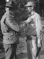 Lieutenant General Joseph Stilwell awarding the Silver Star medal to Colonel Rothwell H. Brown, Hukawng Valley, northern Burma, 18 Mar 1944