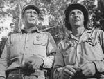 Colonel Rothwell Brown and 2nd Lieutenant Albert Harvey shortly after receiving Silver Star medals from Major General Joseph Stilwell, Hukawng Valley, northern Burma, 18 Mar 1944