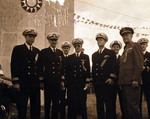 Lieutenant F. M. Edwards, Commander N. M. Carlson, Commander T. A. Gregg, Lieutenant Commander H. D. Lane, and Commander A. E. Wills at the Double Ten Day celebrations, Shanghai Race Course, China, 10 Oct 1945
