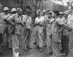 Brigadier General Gilbert Cheves and Lieutenant General Joseph Stilwell speaking with non-commissioned officers, Calcutta, India, 30 Jul 1944
