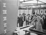 Wife of Vice Admiral V. H. Godfrey launching a newly constructed sloop for the Indian Navy, HMIS Kistna, at Yarrows Yard, Clydebank, Scotland, United Kingdom, 22 Apr 1943