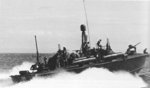 PT-330, an Elco 80-footer of Motor Torpedo Boat Squadron 21 (MTBRon 21), underway in the Philippines, circa 1945. Note the smoke generator canister on the stern.