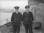 Norwegian destroyer HNoMS Stord’s commanding officer LtCdr Skule Storheill (left) and his first lieutenant Lt T. Holthe aboard the Stord in Rosyth harbor, Scotland, United Kingdom, 4 Jan 1944
