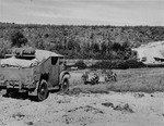 Gun crew using the onboard winch in their Canadian Chevrolet CMP 8440CGT Field Artillery Tractor to pull their QF 25-pounder howitzer up a hill, date and location unknown.