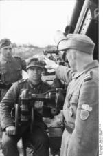 Officer and crew of a large caliber German gun, northern France, 1944