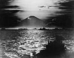US and British warships in Sagami Bay, Japan, 27 Aug 1945; note Mount Fuji with setting sun behind it in background; photo taken from USS South Dakota