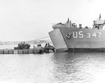 A Rhino barge docked with LST-347 in Portland Harbor, Dorset, England, United Kingdom during preparations for the Normandy invasion, 1 Jun 1944.