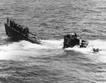 United States Navy salvage crew on the bow and bridge of the captured U-505 off the West African coast, 7 Jun 1944