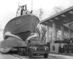 The former PT-796, a 78-foot Higgins boat, painted as PT-109, an 80-foot Elco boat, passing the reviewing stand in President John F. Kennedy’s inaugural parade in Washington DC, United States, 20 Jan 1960.