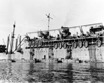 During rehearsals for the New Georgia operation, troops climb down nets hung over the side of attack transport USS McCawley to board LCVP landing craft at Nouméa, New Caledonia, 14 Jun 1943