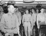 Vice Admiral John McCain arriving aboard carrier USS Shangri-La for Task Force 38 change of command ceremonies, 31 Aug 1945. Note the disbelieving look from one officer seeing McCain’s famous hat for the first time.