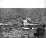 Captured German submarine U-505 three days after her capture as her tow was being transferred from the carrier USS Guadalcanal to the ocean-going tug USS Abnaki in the western Atlantic, 7 Jun 1944.