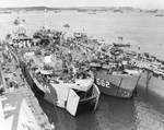 USS LST-646 and USS LST-662 entering the floating drydock USS ABSD-6 in Apra Harbor, Guam, 29 May 1945.