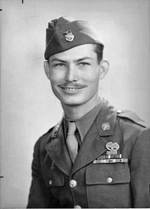Portrait of medical corpsman Desmond Doss, late 1945. Note his ribbon for the Medal of Honor below his Combat Medic Badge. Ribbons also include the Bronze Star, and the Purple Heart with oak leaf cluster.