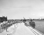 The submarine USS Nautilus approaching the pier at the submarine base in Pearl Harbor, Hawaii, 25 Aug 1942.