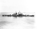 Cruiser USS Houston under tow by the USS Pawnee 17 Oct 1944 following Houston being torpedoed twice off Formosa (Taiwan) three days earlier. Note that Houston’s draft is 6-feet deeper than the maximum to be seaworthy.