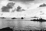 A destroyer escort dropping depth charges on a second Japanese Kaiten in the cruiser anchorage of Ulithi Lagoon on 20 Nov 1944 after the sinking of USS Mississinewa. Seen from USS Bunker Hill. Photo 2 of 3.