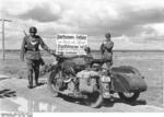 German military police K800 motorcycle in the Soviet Union, Jul-Aug 1941; note sign warning of hostile partisan fighters