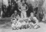 Men of 613th Field Artillery Battalion, US 5332nd Brigade (Provisional) with local children, Burma, 1945, photo 2 of 2; Captain Rolf Larson, Bill Hale, and Holger Munson