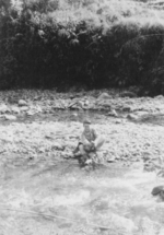 Man of US 5332nd Brigade (Provisional) A. Rossi at a stream, probably Burma, 1945