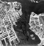 Aerial view of shipping in the Pearl Harbor Navy Yard dry docks, 12 Dec 1943. Note USS Lexington (Essex-class) in the new Drydock No. 4 at the top of the photo.