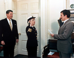 Secretary of the Navy John Lehman promoting Grace Hopper to the rank of commodore, White House, Washington DC, United States, 15 Dec 1983; observed by US President Ronald Reagan